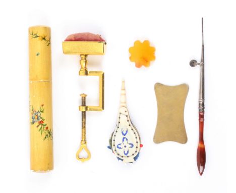 A mixed lot, sewing, comprising a gilded metal sewing clamp with trough form pin cushion, 11.5cms, a pierced bone bellow form