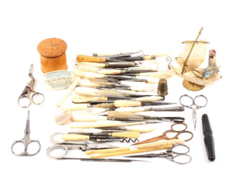 A mixed lot, sewing, comprising a mother of pearl thimble boat, 9cms high, six pairs of scissors including a lace makers pair