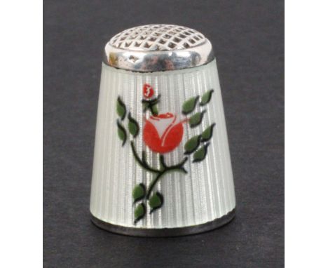A Norwegian silver gilt and enamel thimble with waffle top, depicting a Norwegian rose and leaves and a bud on a basse-taille