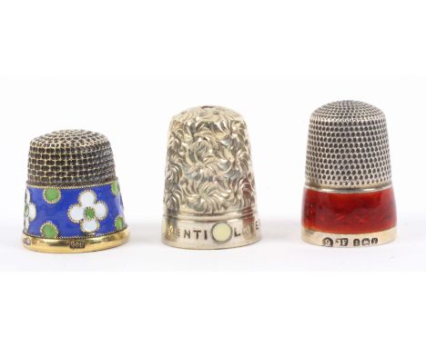 Three thimbles, comprising a Russian silver gilt example with cloisonne border stamped 916 and additional mark, a silver thim