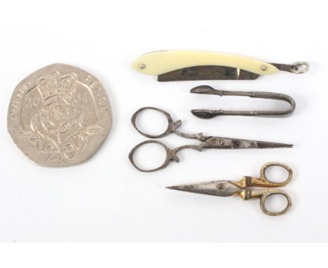 Miniature items, presumably for dolls, comprising a pair of steel scissors, 3.2cms, another pair with gilded handles, 2.5cms,