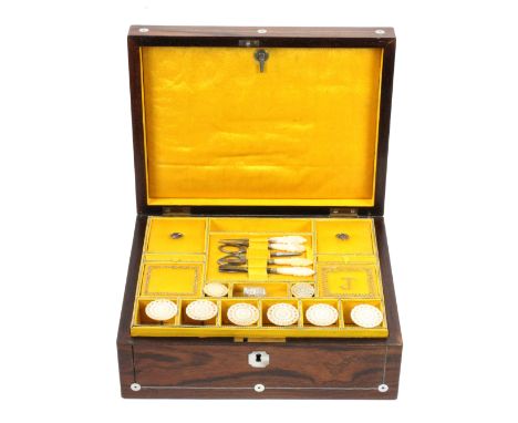 A well fitted rosewood sewing box, circa 1840, of rectangular form, the lid and front with pewter lines and mother of pearl r