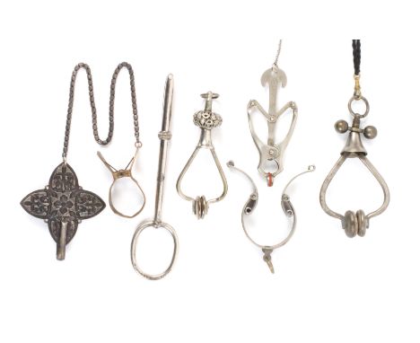 Six various skirt lifters, comprising a plated example stamped to the loop ‘D. Peres Solingen Patent A’, 15.5cms, two screw t