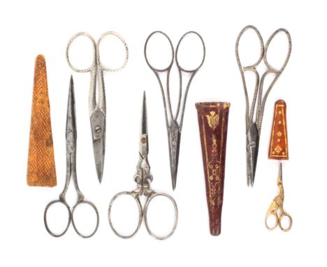 Six pairs of scissors, comprising an unusual pair by ‘Savigny and Co’, with file cut open arms to oval loops, complete with a