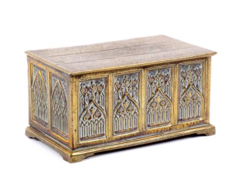 A scarce brass Avery needle case ‘Gothic Coffer’, stamped to base ‘W. Avery and Son, Redditch, Red. 156159’, 6.8cms wide.&nbs