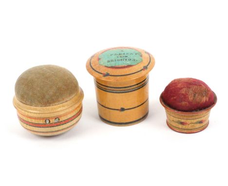 Three charming whitewood paint decorated Tunbridge ware pin cushions, comprising a cylinder box example the overhanging lid w