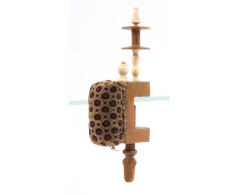 A boxwood sewing clamp, the rectangular frame mounted with an old patterned velvet pin cushion with gold lace border below a 
