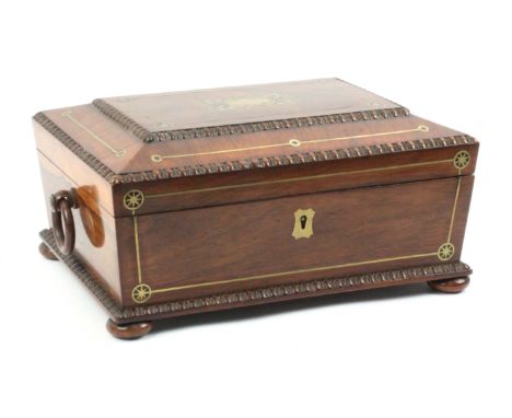 A rosewood sarcophagol form brass inlaid sewing box, circa 1840, raised on bun feet and with side ring handles, the front and