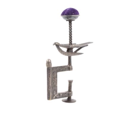An American silver plated hemming bird clamp, the leaf decorated rectangular frame incorporating an acorn top needle case bel