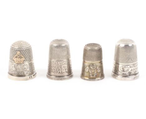 Four English silver Royal commemorative thimbles, comprising an example with Prince of Wales feathers within engraved border,