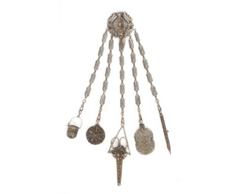 A plated base metal chatelaine, the elaborate pierced hook mount centred by the head of a warrior in winged helmet, with five