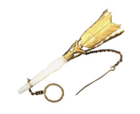 A posy holder, the turned tapering mother of pearl stem with ring and chain below a gilt metal trumpet formed from four gilt 