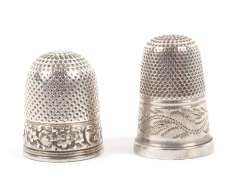Two silver thimbles, comprising a mid 18th Century example probably for a child, the frieze with a winged cherubs head within