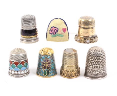 Seven thimbles, comprising a ‘935’ example with enamel frieze of figures chasing geese, a Russian cloisonne example, a Chines