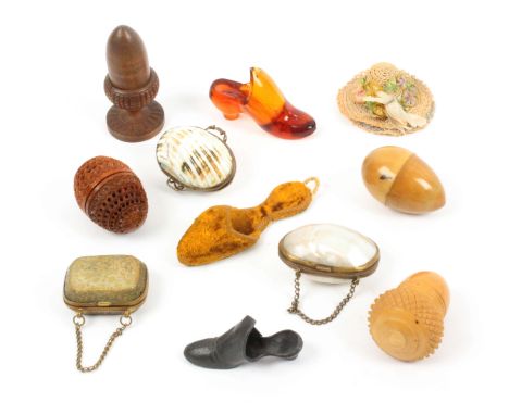 Eleven thimble holders and cases, comprising slipper form examples in glass, pewter and velour, largest 8.5cms, three purse f