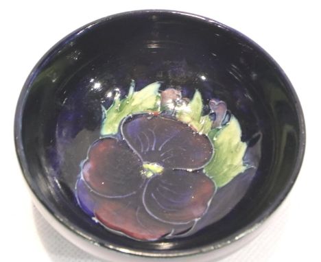 Moorcroft footed bowl in the Pansy pattern, D: 80 mm, light crazing but no chips or cracks. P&amp;P Group 1 (£14+VAT for the 