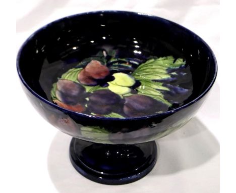 Plum Wisteria Moorcroft footed dish, D: 26 cm. Crazed throughout, 5cm crack to rim. P&amp;P Group 3 (£25+VAT for the first lo