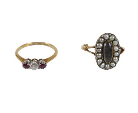 Two gold rings, comprising of a 18ct gold band ring with seed pearls size L weighing 4g, and an 18ct gold and platinum ring w