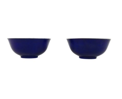 A pair of Chinese porcelain monochrome bowls, with gently mottled cobalt blue glaze to the outside, white glaze internally an