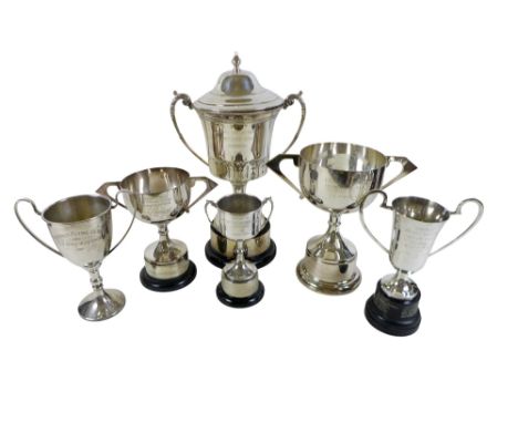 Six silver plated trophy cups, to include a large twin handle lidded cup with embossed leaf design, 32 by 20 by 50cm high, al