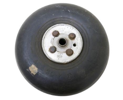 A WWII Spitfire or Hurricane tail wheel A836 AL/287 with an AERO tyre 29 by 12cm. 
