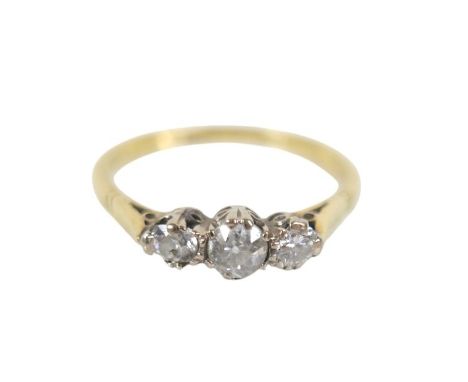 A 18ct gold and platinum three stone diamond ring, with a 0.25ct central stone, size R, 2.8g.