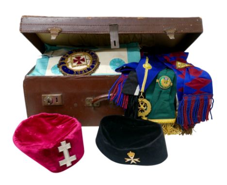 Masonic interest: a collection of masonic clothing including two hats, several aprons, cloak, sashes, regalia, in brown leath