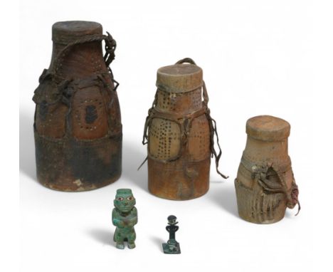 A collection of assorted tribal items, comprising a primitive carved jade style stone figure, 7cm high,  a small bronze slave