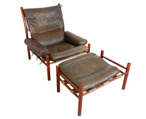 An 'Inca' armchair and footstool, designed by Arne Norell for Norell Mobler, with mushroom leather seats, on stained frames, 