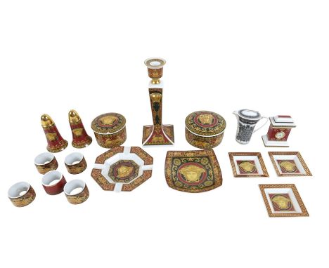 A collection of Medusa Versace Rosenthal porcelain ware comprising a candle stick, two lidded pots, a clock, salt and pepper,