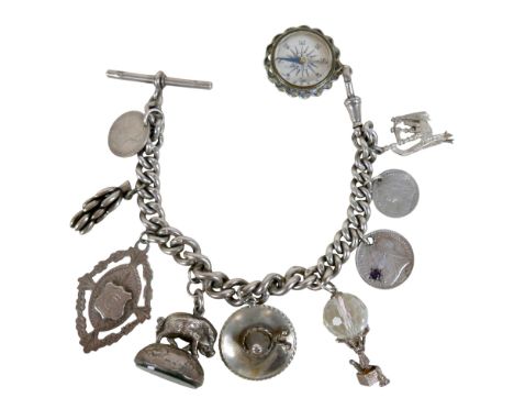 A silver watch chain charm bracelet 19cm in length, 67.6g.