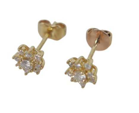 A pair of 18ct gold and diamond flowerhead earrings, the backs marked 750, 1.6g.