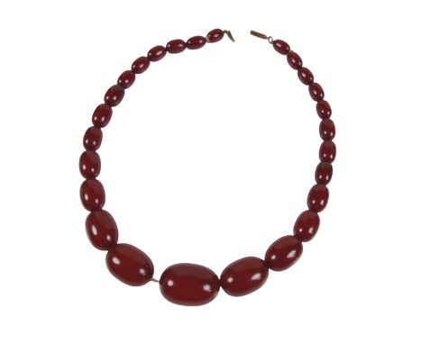 A graduated bead necklace with possibly amber stones, with twenty six beads in total, 23.0g, largest bead 15.5 by 22mm, 34cm 