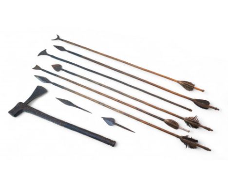 An African tribal hand axe, with carved wooden handle, 43cm long, together with a collection of arrows, all of various design