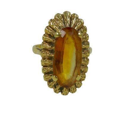 A 9ct gold ring with large oval stone possibly citrine, in bark textured flowerhead setting (marked 375), size N