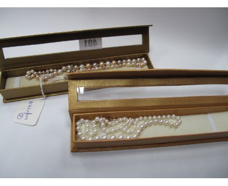 A Modern Graduated Single Strand Pearl Bead Necklace, to snap clasp stamped "925", inset to the centre; Together with A Moder