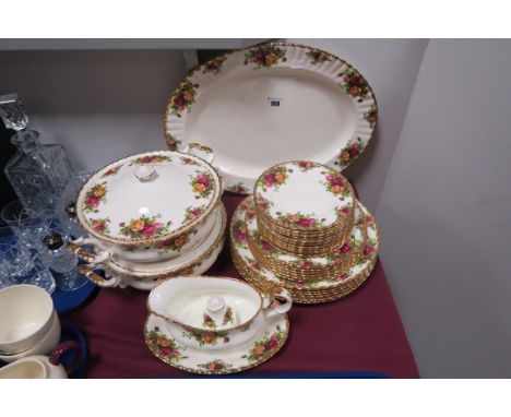A Royal Albert 'Old Country Roses' Oval Meat Plate, two lidded tureens (one cracked), pepperette, five dinner, two dessert, t