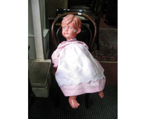 A Late XIX Century Child's Bentwood Chair, with a Dutch girl scene to the seat, a celluloid boy doll, reproductions photograp