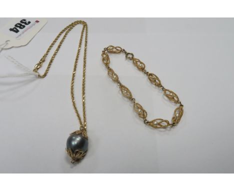 A Modern Ropetwist Chain Necklace, stamped "14K", set to the front with a large grey pearl; Together with A Fancy Link Bracel