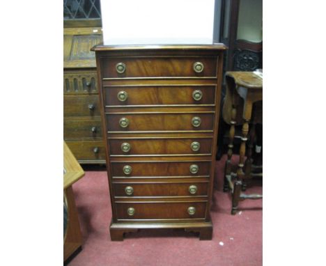 A Mahogany Music Cabinet, with a moulded edge, seven drawers, with fall front, on bracket feet,