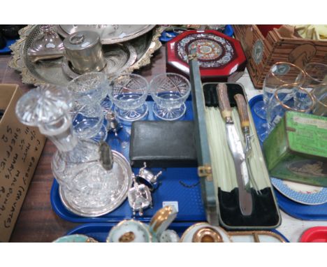 A Cut Glass Decanter with Label, four cut glass dessert dishes, silver plated cruet set, leather cased manicure set plus a pa