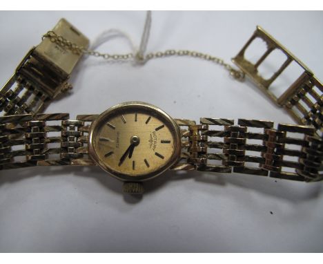 Rotary; A 9ct Gold Cased Ladies Wristwatch, the signed dial with baton markers, to integral bracelet with 9ct gold clasp.