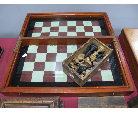 A Victorian Cased Folding Glass Chess Board, together with chess pieces.