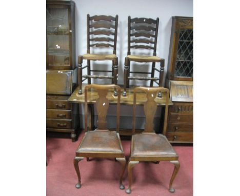 An Oak Refectory Dining Table, two ladder back, and two Queen Anne style chairs. 