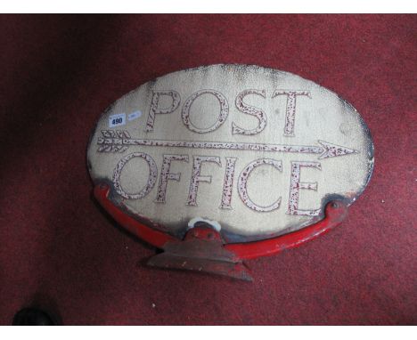 A Post Office Oval Enamel Sign, circa early XX Century featuring arrow to location, on red iron cradle, 33.5cm high 46cm wide