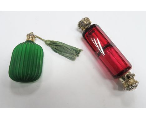 A Ruby Glass Double Ended Scent Bottle, each hinged cover (one detached) detailed in relief; together with a frosted green gl