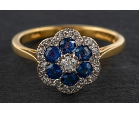 An 18ct gold, round, mixed-cut sapphire and round, brilliant-cut diamond cluster ring, of flowerhead design, total estimated 