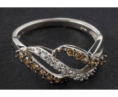 A three-row diamond cross-over ring, total estimated diamond weight ca. 0.40ct, the two flanking rows of fancy light brown hu