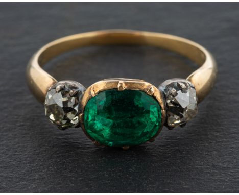 A 19th century, oval, mixed-cut, foiled back, emerald and cushion-cut diamond, three-stone ring, total estimated diamond weig