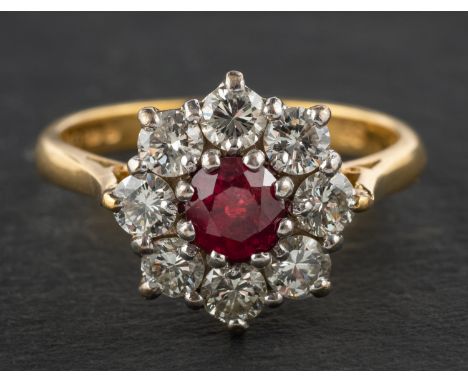 An 18ct gold, round, mixed-cut ruby and round, brilliant-cut diamond cluster ring, estimated ruby weight ca. 0.60ct, total es